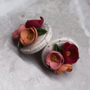 floral studs on white background
