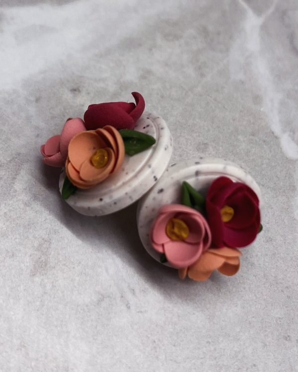 floral studs on white background